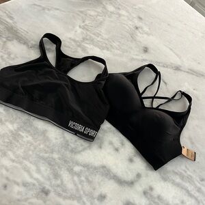 Two black Victoria’s Secret bras